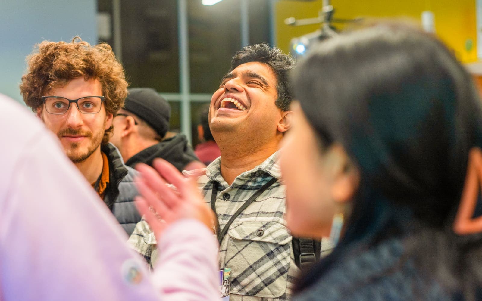Attendees laughing together during a session