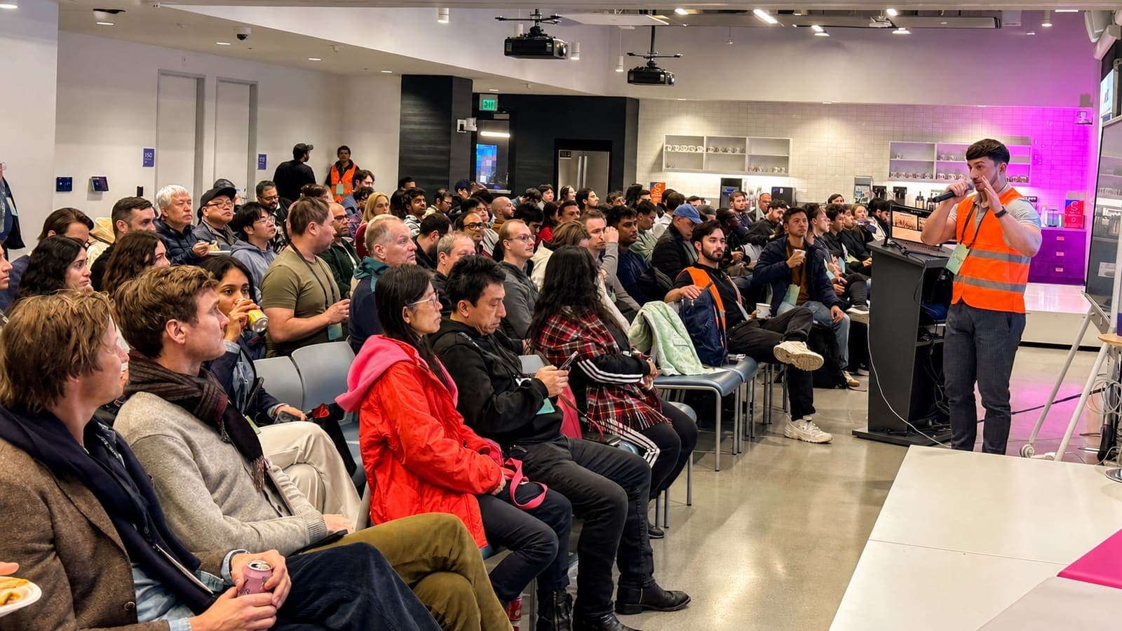 A packed room at an AI Collective demo night